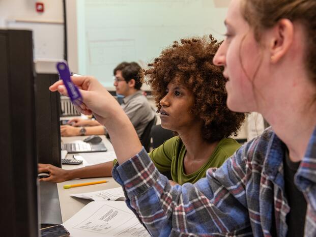 Photo of two students working in their engineering class