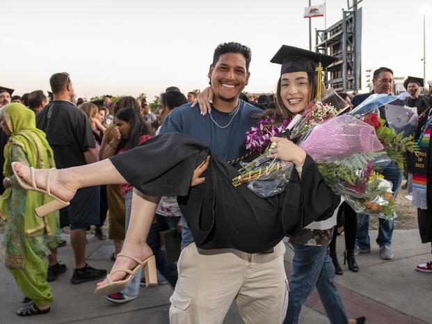 Photo of a happy Delta College graduate