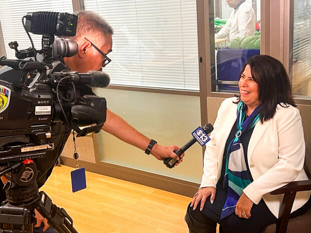 Delta's president is interviewed by a television reporter