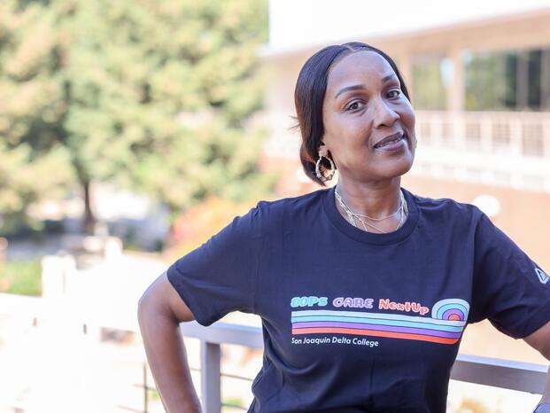 Photo of an EOPS student wearing an EOPS shirt