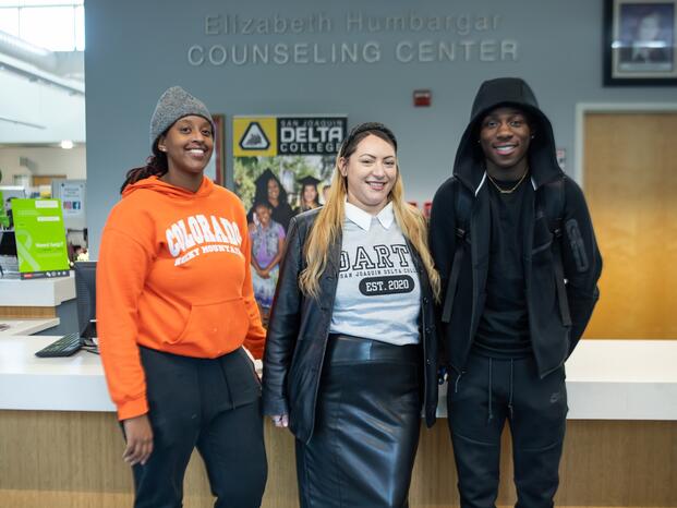 Photo of three students standing in the Counseling Center