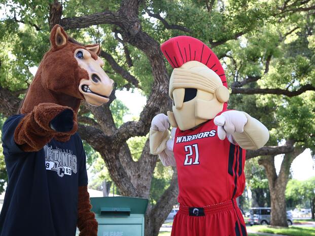Fierce the Mustang poses with the Stanislaus State mascot