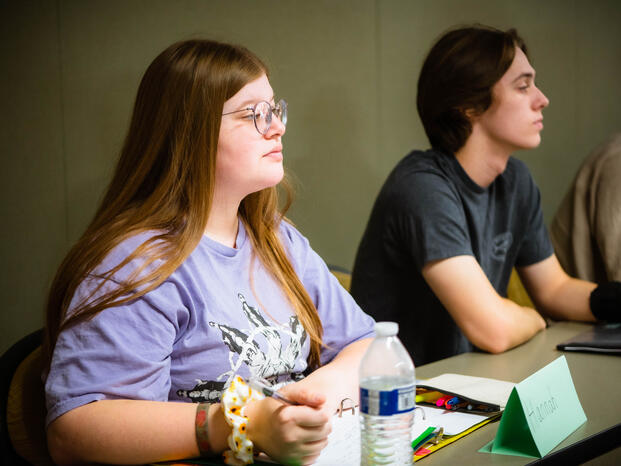 Photo of a student listening during a lecture.