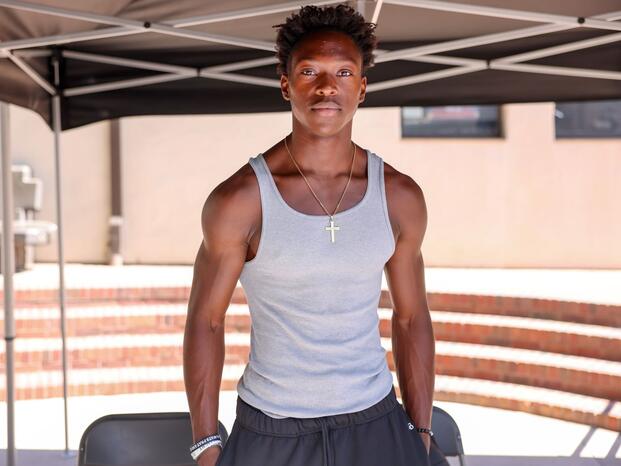 Student smiling while tabling at Club Rush event