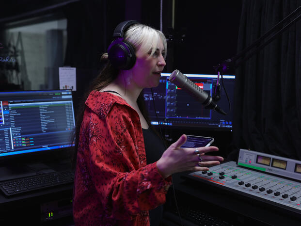 Digital Media Student in sound booth 