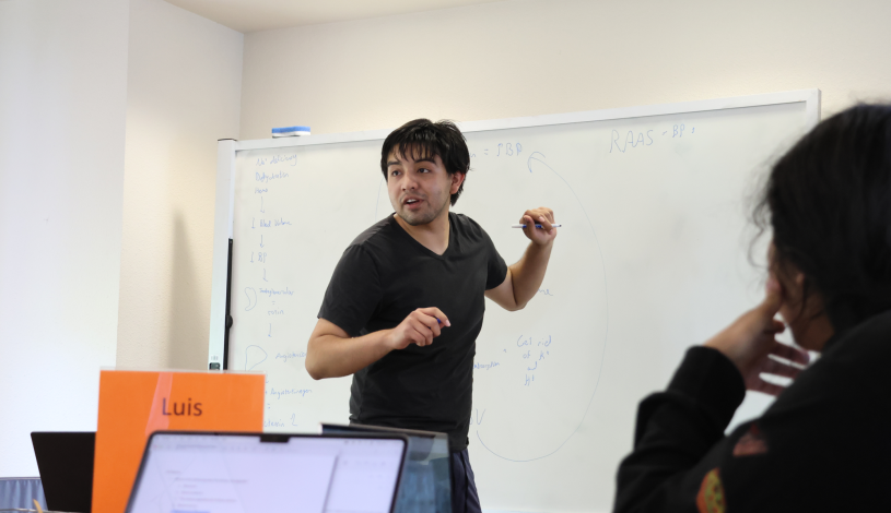 teacher writing on the whiteboard