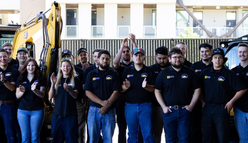 Students graduating from Delta's Caterpillar program
