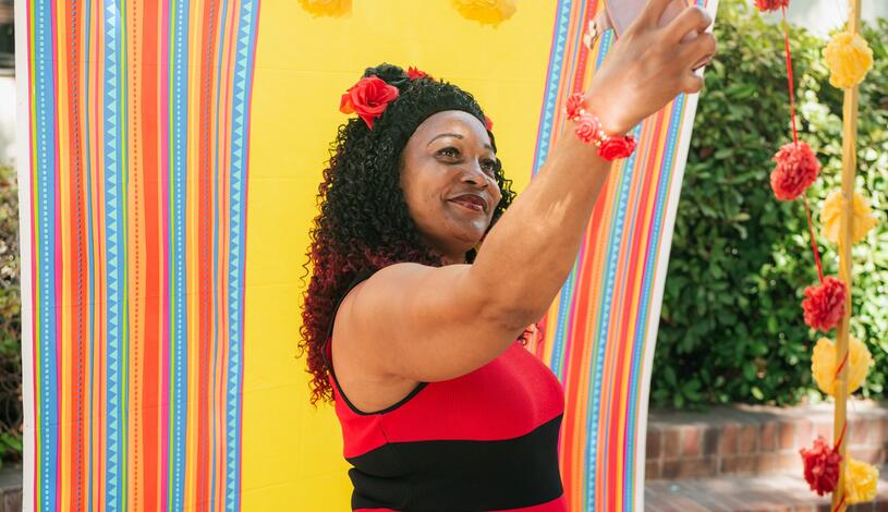A woman takes a selfie in the Delta College quad