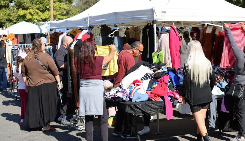 Shoppers explore booths at The Market