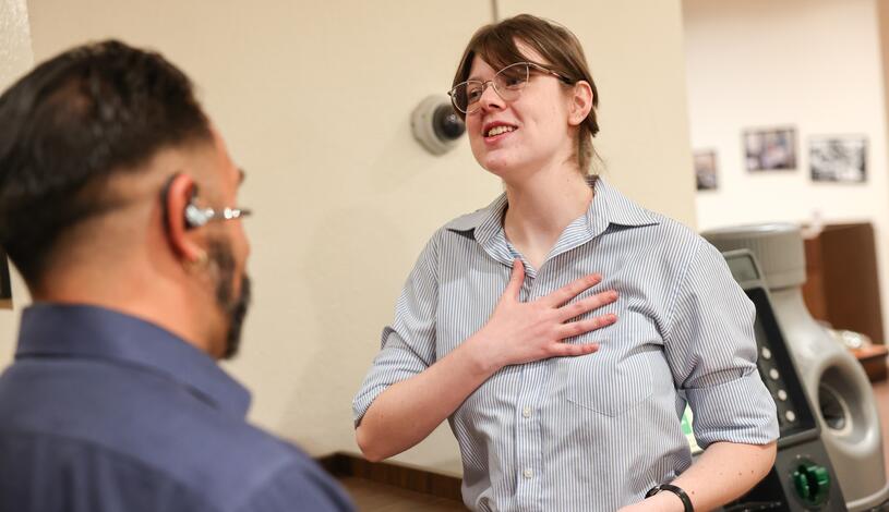 A student talks with another student at a professional mixer