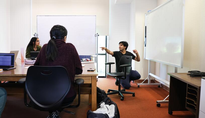 A tutor works with students at one of Delta College's learning labs.