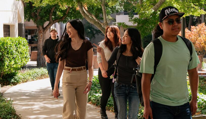 Delta students walking through a beautiful campus