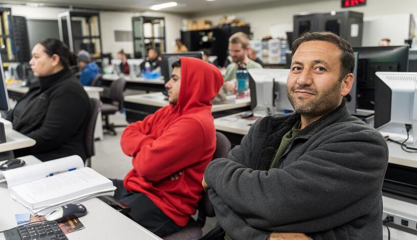 Photo of a student attending computer networking class