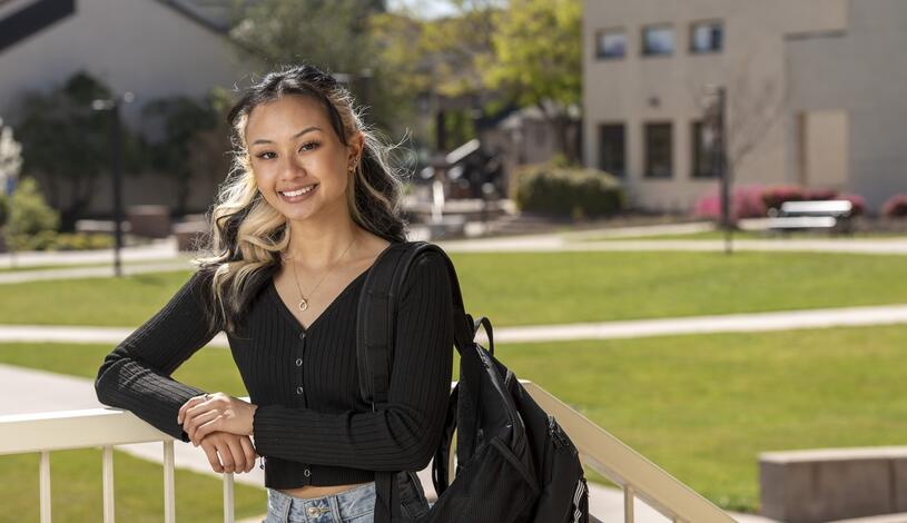 A Delta College student poses for a photo near the Dolores Huerta Plaza