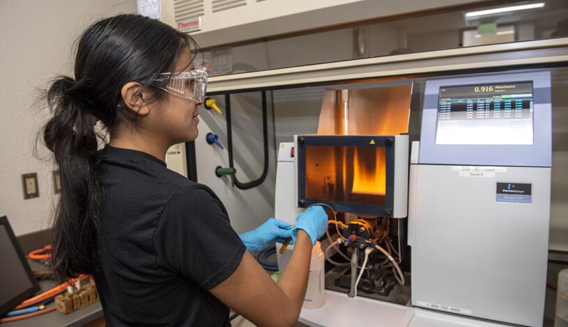 A chemistry student working in the lab