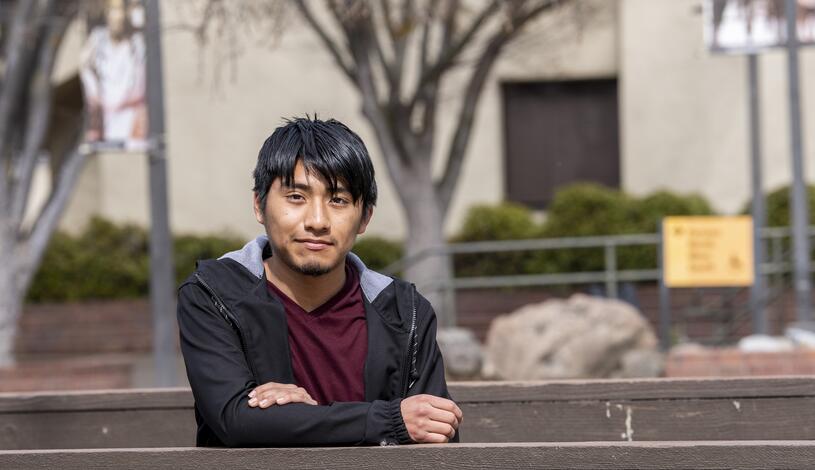 A Delta College student poses for a photo in the Quad