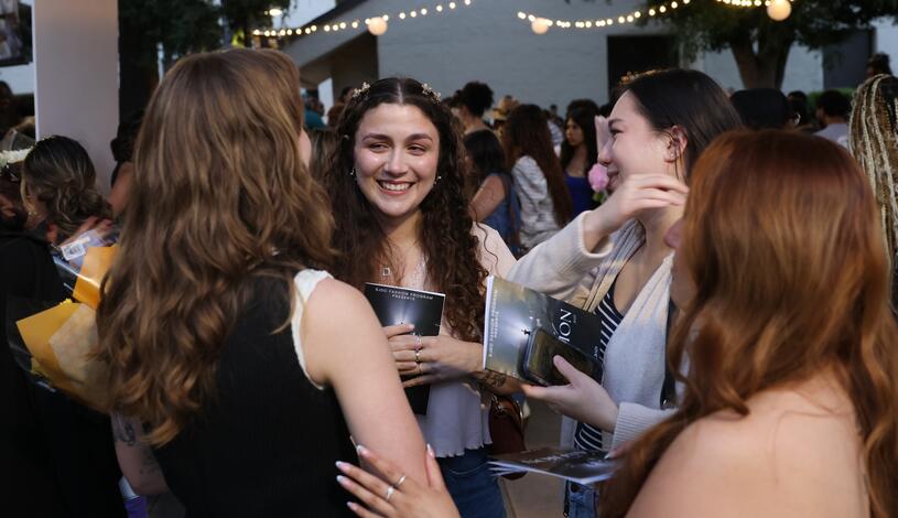 Photo of students gathering for the annual Fashion Show