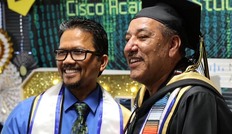 Professor Sergio Calderon smiles during the Cisco Networking Academy graduation