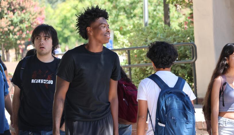 Photo of students walking through the Quad during Mustang Week