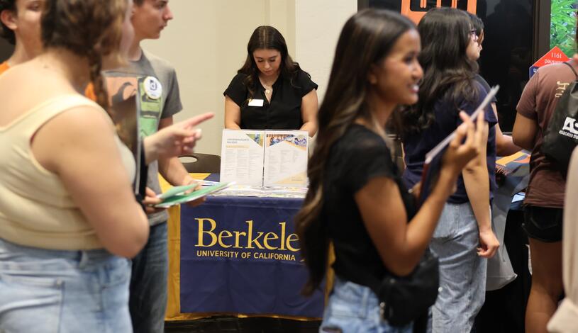 Photo of a representative from UC Berkeley at Delta's College Night