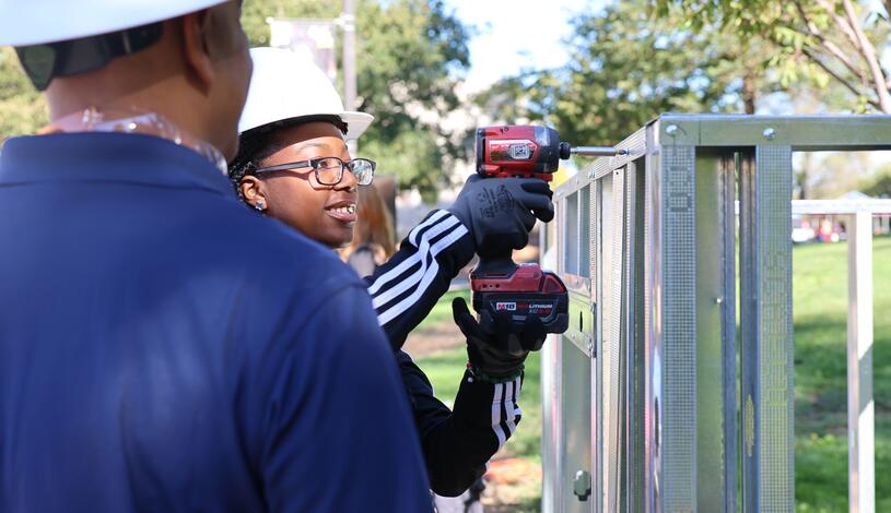 A student practices her drilling skills