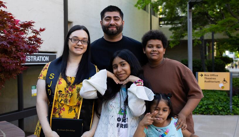 A family poses for a photo after the CTE certificate ceremony at Delta College