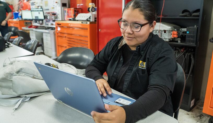 Photo of a student in her electric vehicle class