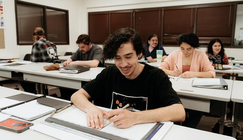 Photo of a student working in architectural drafting