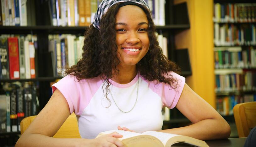 Photo of a student studying at Goleman Library