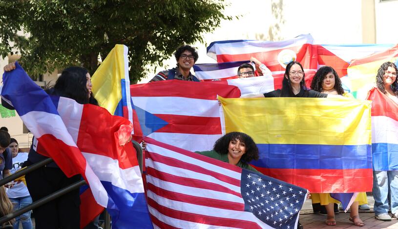 Group of students holding international flags