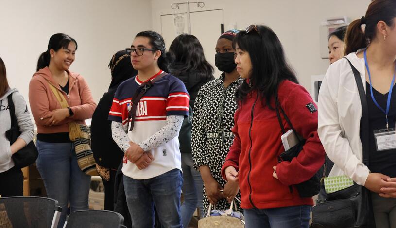 A group of adult students taking a tour of Delta