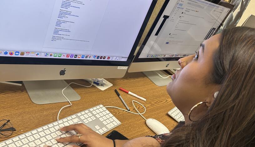 Photo of a Collegian editor planning stories