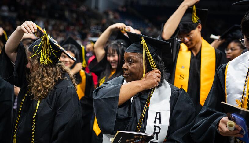 Photo of a student turning her tassel at Commencement.