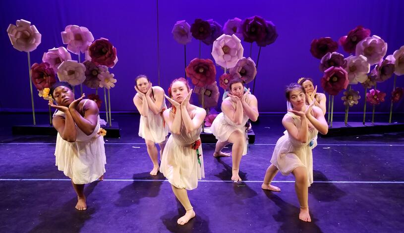 A group of dancers performing on stage 