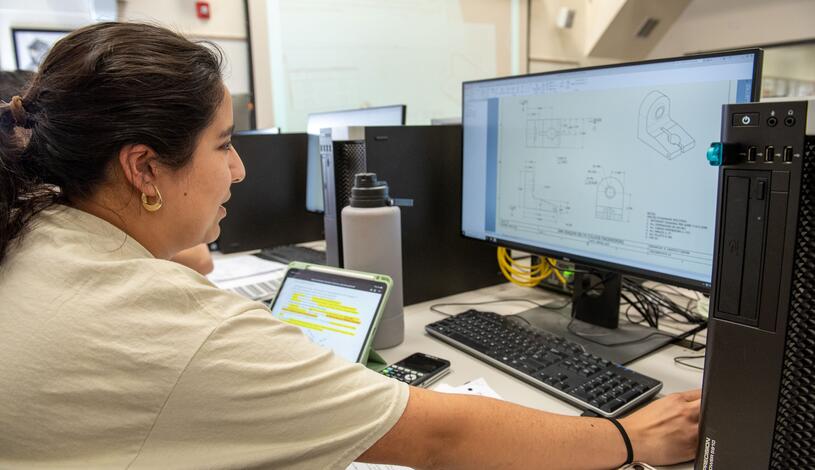 A Delta student working on an Engineering project