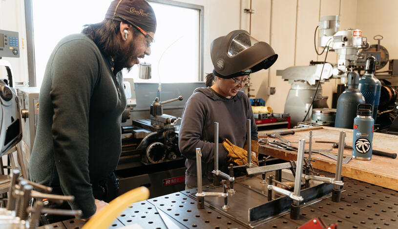 Two students working in an Auto Body class