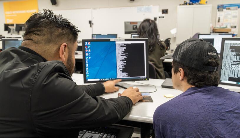 CISCO students use a computer as part of their computer networking class
