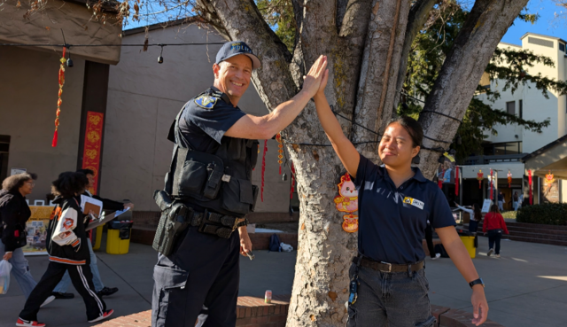 Delta College police high fiving each other