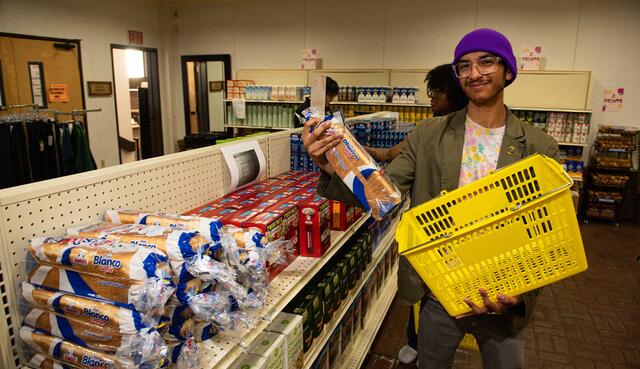 Photo of a student getting bread at the Student Food Pantry