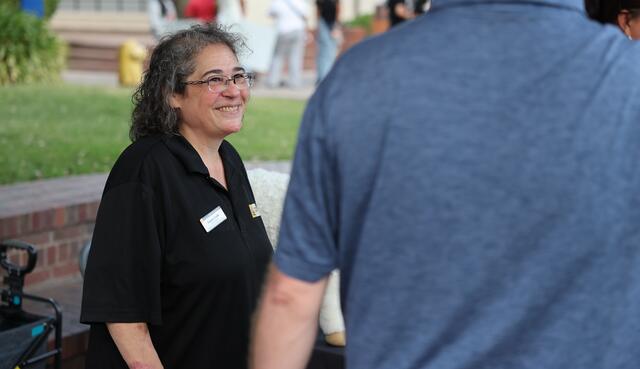 Photo of an academic advisor talking with a student.