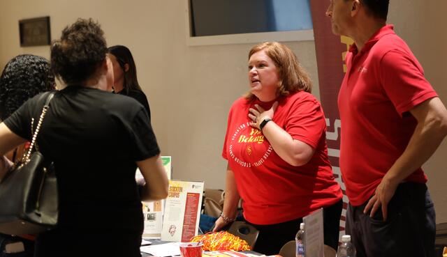 Photo of representatives from Stanislaus State visiting with Delta students