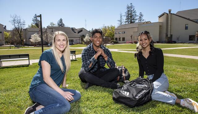 Photo of students sitting on Dolores Huerta Plaza