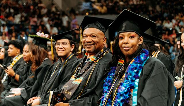 A group of graduating students wearing cap and gowns