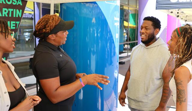 Delta College speaker engaging with a group of students at a Delta campus event