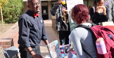 An HBCU representative talking with a Delta College student