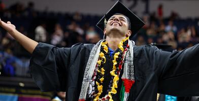 Photo of a student celebrating at Commencement