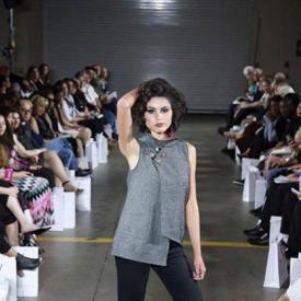 student performs in fashion show