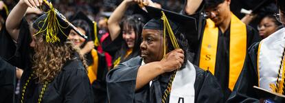 Photo of a student turning her tassel at Commencement.