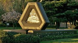 Photo of the Delta College steamboat sign at the Pacific Avenue entrance at sunrise