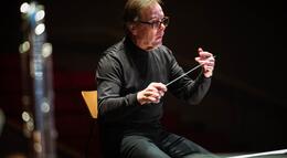 Photo of the band director at a concert